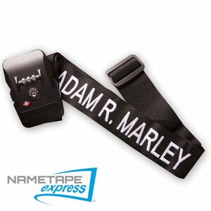 May include: Black luggage strap with a combination lock and the name "ADAM R. MARLEY" embroidered in white.