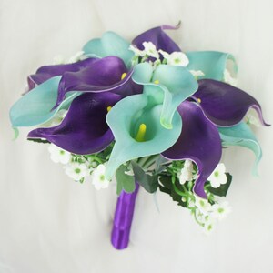 May include: A bridal bouquet of purple and teal calla lilies with white baby's breath.
