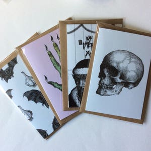 Set of four creepy greetings cards