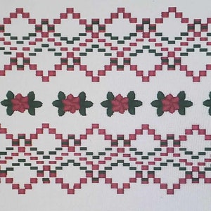 May include: A white background with two rows of a red and black geometric pattern. The top and bottom rows are identical. In the middle row, there are eight red flowers with green leaves.