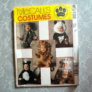 May include: A McCall's Costumes pattern for baby animal costumes. The pattern includes designs for an elephant, panda, lion, skunk, and lion. The pattern is labelled M6105 and is size 1/2.