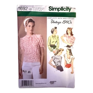 May include: Simplicity sewing pattern 1692 H5 for 1940s style blouses. The envelope features a photograph of a floral print blouse with short sleeves and tie details, alongside illustrations of four different blouse variations with text.