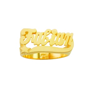 May include: Gold ring with the name "Falynn" in a retro font style. The ring has a star design on the side.