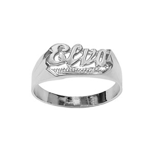 May include: A silver ring with the name "Elva" engraved in a cursive font.