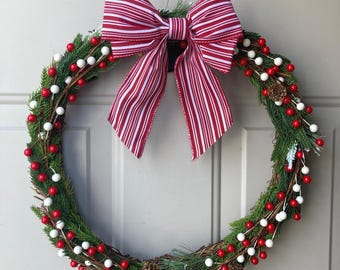 Corona navideña - Lazo de bastón de caramelo, bayas rojas y blancas