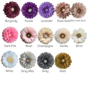May include: Assortment of 12 large paper flowers in various colours, including burgundy, purple, lavender, rose gold, Bermuda sand, dark pink, blush, champagne, vanilla, birch, white, grey mist, grey, and gold.