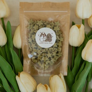 May include: A set of three ceramic mugs with a speckled, matte finish. The mugs are in shades of cream, light gray, and dark gray. Each mug has a simple, minimalist design, perfect for coffee or tea.