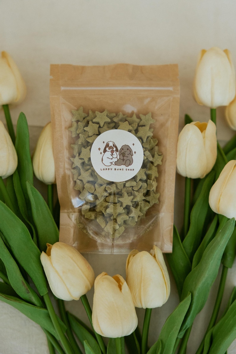 May include: A set of three ceramic mugs with a speckled, matte finish. The mugs are in shades of cream, light gray, and dark gray. Each mug has a simple, minimalist design, perfect for coffee or tea.