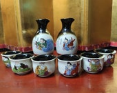 Japanese Kutani Sake Set With Painting Of The 7 Japanese Gods of Good Fortune