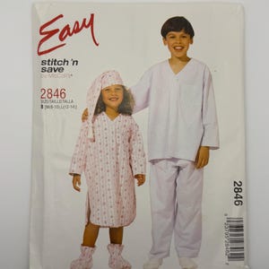 May include: A McCall's Easy stitch 'n save sewing pattern envelope 2846 featuring illustrations of two children wearing pajamas. One child wears a long-sleeved nightshirt with a matching nightcap and slippers, while the other wears a pajama set.