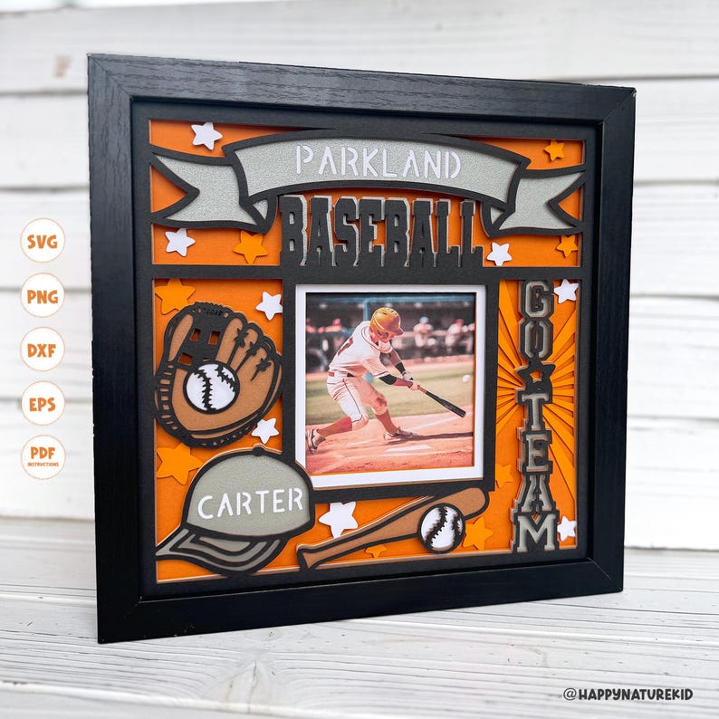 May include: A black framed photo with an orange background and a baseball theme. The photo includes a baseball glove, a baseball bat, and a baseball player. The text "Parkland Baseball" and "Go Team" are included in the design. The name "Carter" is also included in the design.