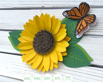 Può includere: Un girasole di carta con petali gialli e un centro marrone, accompagnato da foglie verdi e una farfalla arancione e nera. L'immagine include il testo "SVG PNG DXF EPS PDF INSTRUCTIONS" e l'handle di Instagram "@HAPPY NATURE KID".