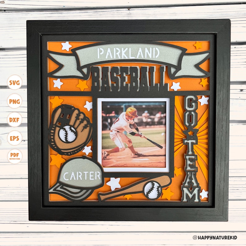 May include: A black framed picture with an orange background. The picture has a baseball theme with a baseball glove, bat, and ball. The text "Parkland Baseball Go Team Carter" is on the picture.