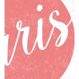 May include: A pink and white graphic with the word "ris" in white cursive lettering on a pink background.