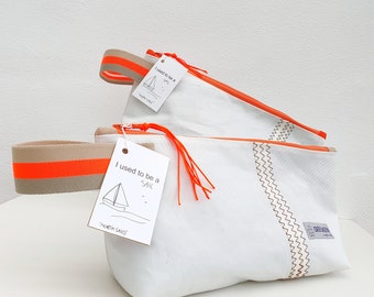 Upcycled toiletry bag, pouch made from recycled sailboat sail. Light, cheerful and water-repellent. A sustainable, zero waste and vegan gift.