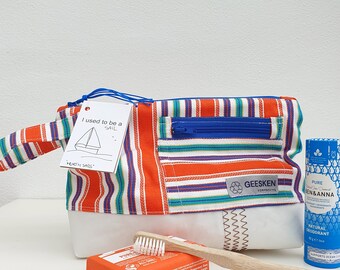 Dutch toiletry bag made from recycled sailboat sail and traditional costume fabric. A unique holiday gift as a beach pouch or toiletry bag.