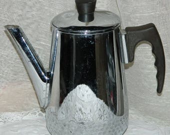 French kettle. Chrome metal kettle coffee maker (year 1970) for decoration, vintage pop