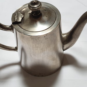 MILK POT in silver metal.