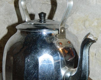 French kettle. Chrome metal kettle (1960s) for decoration, vintage pop