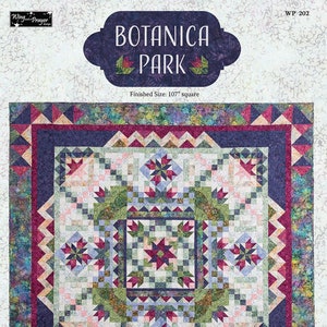 May include: A quilt pattern called "Botanica Park" with a finished size of 107 inches square. The quilt features a central square with a star design surrounded by a border of smaller squares and a larger border of triangles. The quilt is made in shades of green, blue, pink, and purple.