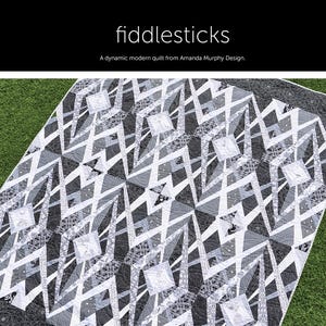 May include: A black and white quilt pattern with a geometric design. The quilt is called "Fiddlesticks" and is a dynamic modern quilt from Amanda Murphy Design.