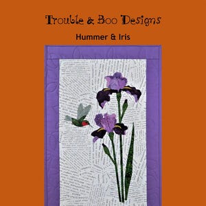 May include: A purple and white fabric quilt block with a hummingbird and irises. The background is made of printed text. The text "Trouble & Boo Designs" and "Hummer & Iris" are at the top of the image. The text "Kristadyelle@gmail.com" and "All Rights Reserved" are at the bottom of the image.