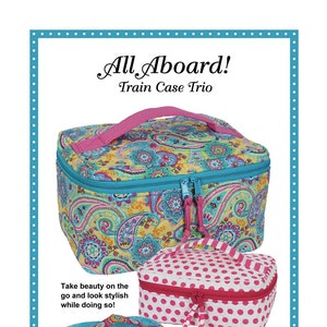 May include: Three colorful train cases with paisley, polka dot, and geometric patterns. The cases are zippered and have handles. The text "All Aboard! Train Case Trio" is at the top of the image. The text "Take beauty on the go and look stylish while doing so!" is below the largest case. The text "Whether you're globetrotting or touring closer to home, you'll love these stylish cases for carrying cosmetics, jewelry, first aid supplies, and more." is below the three cases. The text "Use the larger case for extended vacations and the smaller cases for a quick weekend getaway. Throw in your glam and you're ready to go anywhere!" is below the previous text. The text "Patterns by Annie www.ByAnnie.com 435-674-9816" is at the bottom of the image.