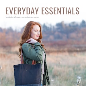 May include: A woman wearing a green jacket and blue jeans is holding a black and denim tote bag with brown leather straps. The bag has a small pocket on the front. The text "EVERYDAY ESSENTIALS" and "a collection of 3 modern accessories to sew and use" is at the top of the image. The text "noodlehead ANNA GRAHAM" is at the bottom of the image.