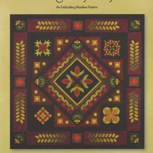 May include: A square embroidery machine pattern titled "Imaginary Day" by Smith Street Designs. The design features a central diamond shape with floral and leaf motifs in red, green, and yellow on a dark background. The border includes similar patterns.