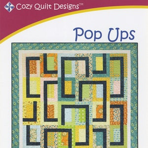 May include: A quilt pattern called "Pop Ups" designed by Daniela Stout. The pattern uses fat quarters and includes instructions for table runner, throw, twin, queen, and king sizes.