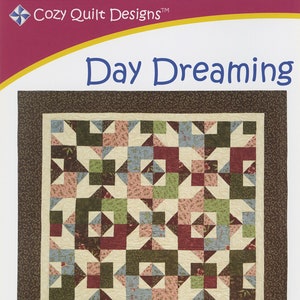 May include: A quilt pattern called "Day Dreaming" by Daniela Stout. The pattern uses fat quarters and is available in lap, throw, full, and king sizes.