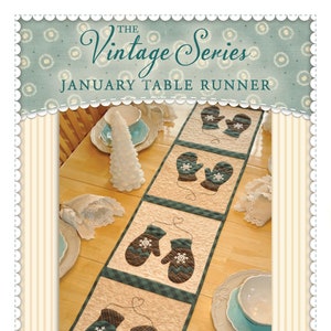 May include: A quilted table runner with a winter theme featuring a pattern of mittens with snowflakes. The table runner is beige with green and brown accents. The text "The Vintage Series January Table Runner" is at the top of the image.