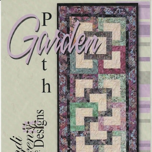 May include: A quilt pattern for a bed runner called "Garden Path" by Cindi MeCracken Designs. The pattern features a geometric design with a black, white, and green color scheme. The quilt is 27 inches by 77 inches.