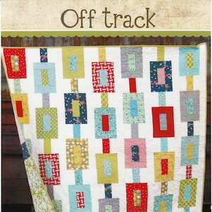May include: A quilt pattern called "Off Track" featuring a white background with colorful squares and rectangles. The pattern is described as a "jelly roll friendly quilt in 3 sizes". The pattern is from Chuck Cluck Sew and is numbered #123.