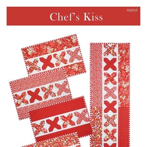 May include: A red and white quilted placemat and runner set with an "X" design. The set includes four 12.5" x 18" placemats and a 12.5" x 40.5" runner. The words "Chef's Kiss" are at the top.