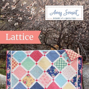 May include: A quilt with a lattice pattern in shades of blue, pink, yellow, and green. The quilt is made of various fabrics with different patterns, including floral, polka dot, and plaid. The quilt is hanging on a clothesline in front of a tree with white blossoms. The quilt is titled "Lattice" and the artist is "Amy Smart, Diary of a Quilter."