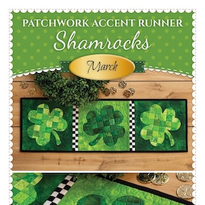 May include: A green patchwork table runner with a shamrock design. The runner is made of green fabric with a checkered pattern. The runner is trimmed with black and white checkered fabric. The runner is labeled "Patchwork Accent Runner Shamrocks March" and "Shabby Fabrics.com".