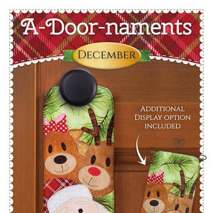 May include: A-Door-naments December door hanger featuring a Santa, reindeer, and plaid design. The hanger is green with a brown wooden door behind it. The text "Additional Display Option Included" is in a white box with a red heart.
