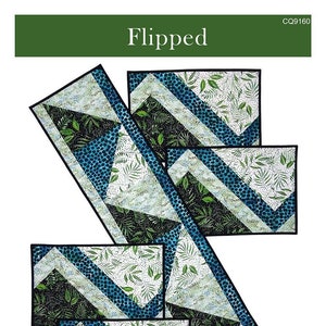 May include: A quilting pattern for a table runner and placemats. The pattern features a geometric design with blue, green, and white fabric. The pattern is called "Flipped" and is from Canuck Quilter Designs. The runner is 11 1/2 inches by 48 1/2 inches and the placemats are 12 1/2 inches by 18 1/2 inches.