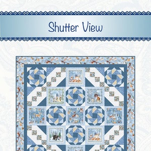May include: A blue and white quilt with a winter forest theme. The quilt features square panels with images of deer, bears, and foxes in a snowy landscape. The words "Shutter View" are at the top.