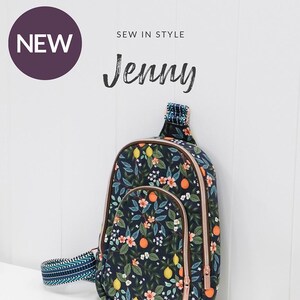 May include: A new sewing pattern for a modern sling bag with a concealed back zipper pocket and interior mesh pockets. The bag is designed with a floral print featuring lemons, oranges, and flowers on a dark blue background. The pattern is by Jessica Barrera and is available from Sallie Tomato.