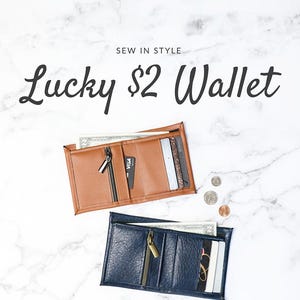 May include: Two bifold wallets, one brown and one blue, with zipper closures and card slots. The text "Lucky $2 Wallet" is at the top of the image. The text "Sallie TOMATO" is at the bottom of the image. The text "functional bifold wallet with plenty of pockets feature cork, faux leather, or kraft-tex" is in the middle of the image.