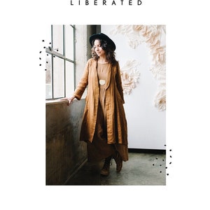 May include: A woman wearing a brown linen duster with a black hat and boots. The duster has a long, flowing silhouette and is cinched at the waist. The text "LICHEN DUSTER" is displayed below the image.