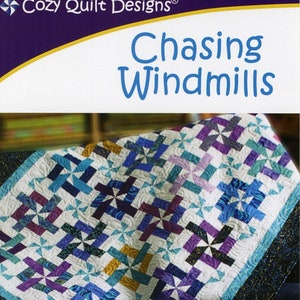 May include: A quilt pattern titled "Chasing Windmills" with a geometric design in shades of blue, purple, and white. The pattern is for 2 1/2" strips and includes instructions for table runners, lap quilts, throws, and twin, queen, and king sizes.