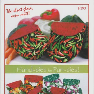 May include: Oven mitts with red chili pepper and vegetable patterns. The mitts have a red flap and are displayed with vegetables. Text reads "The short glove, oven mitt!" and "Hand-sies for Pan-sies!"