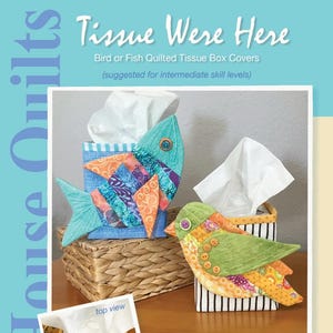 May include: Two quilted tissue box covers, one shaped like a bird and the other like a fish. The bird is green and yellow with a black and white striped box. The fish is blue and orange with a blue and white striped box. The text "Tissue Were Here" is at the top of the image. The text "Java House Quilts" is at the bottom of the image.