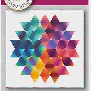 May include: A colorful quilt pattern titled "Lotus 2.0" with a geometric design. The quilt measures 62 inches by 62 inches and features a vibrant array of colors including blue, green, orange, red, and purple. The design is made up of diamond shapes.