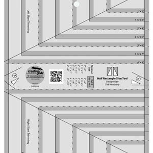 May include: A black and white ruler tool for quilting with measurements in inches. The ruler is labeled "Half Rectangle Trim Tool" and "Cut 2 for 2 HRT". The ruler has a diagonal line and multiple parallel lines for trimming fabric.