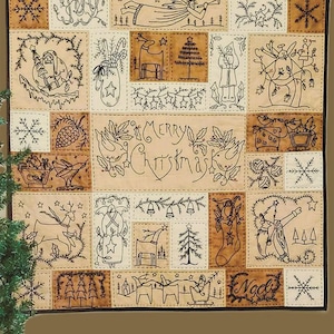 May include: A Christmas sampler with various holiday-themed illustrations in a patchwork design. The sampler features images of angels, reindeer, Christmas trees, and the words "Merry Christmas" and "Noel". The design is in black and tan with the "Sew Cherished" logo.