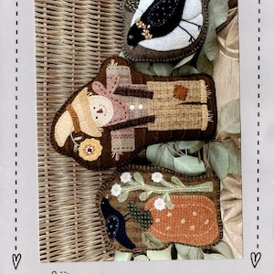 May include: Three felt wool bowl filler designs, a scarecrow, a bird, and a pumpkin, with the text "#432 Pumpkin Patch Bowl Fillers" and "Heart to Hand" on a beige background. The designs are approximately 4 to 6 inches wide and 5 to 8 inches high.